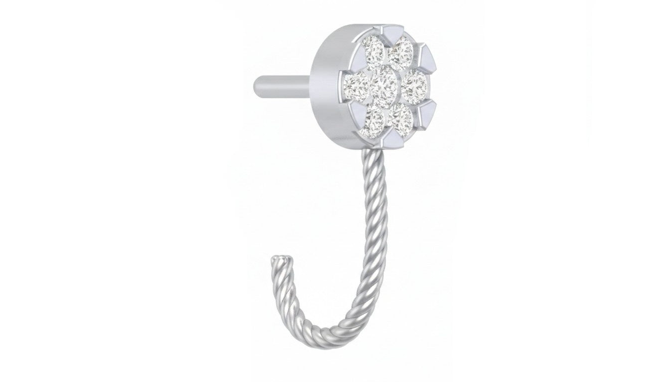 white gold and diamond nose ring on a teal white background