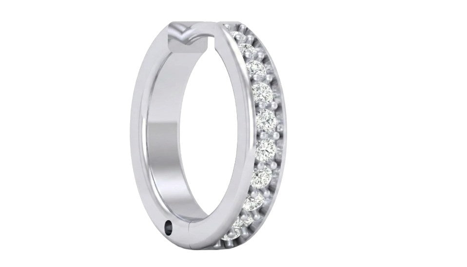 white gold and diamond nose ring with embedded stones on a white background