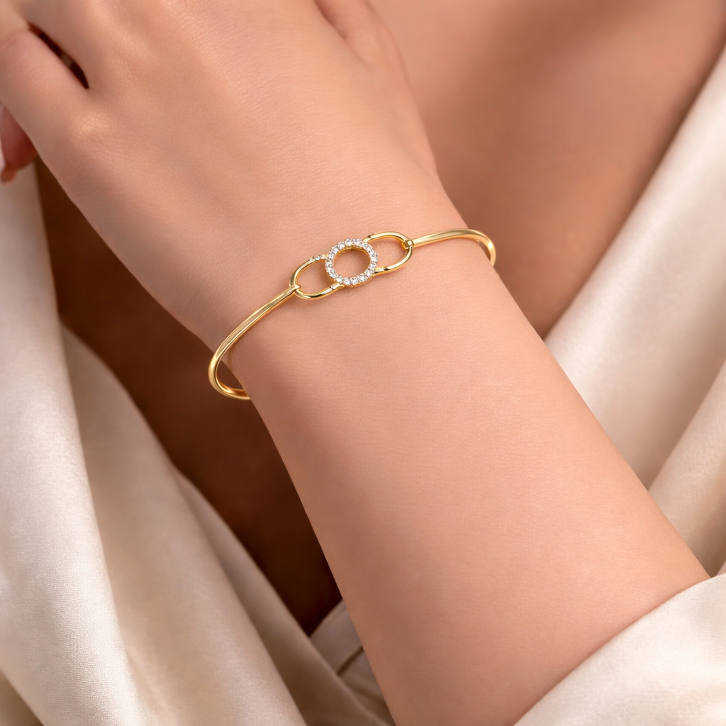 Gold and Diamond bracelet with a diamond design on a wrist of a women