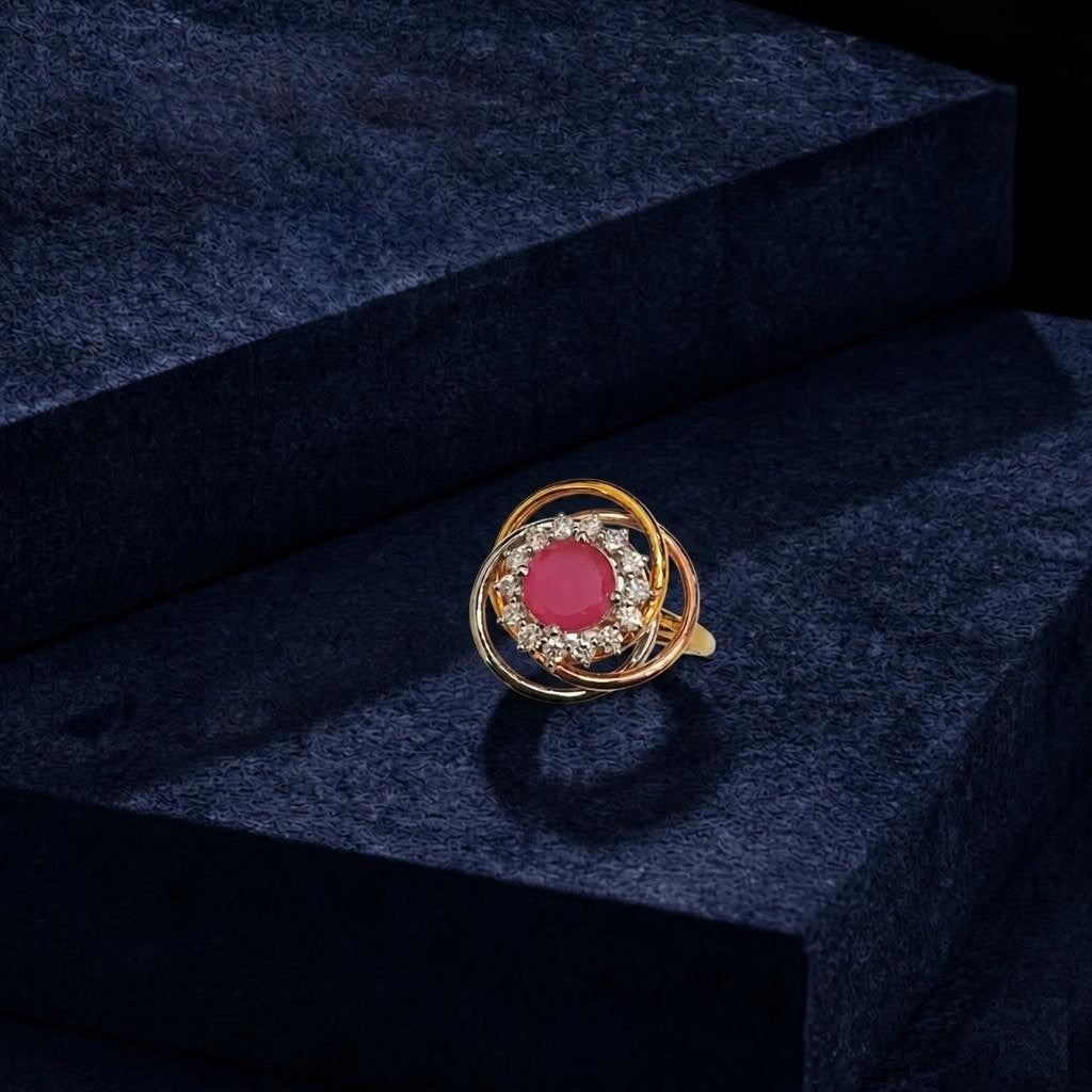 Tri-color gold and diamond with ruby gemstone on a blue surface.