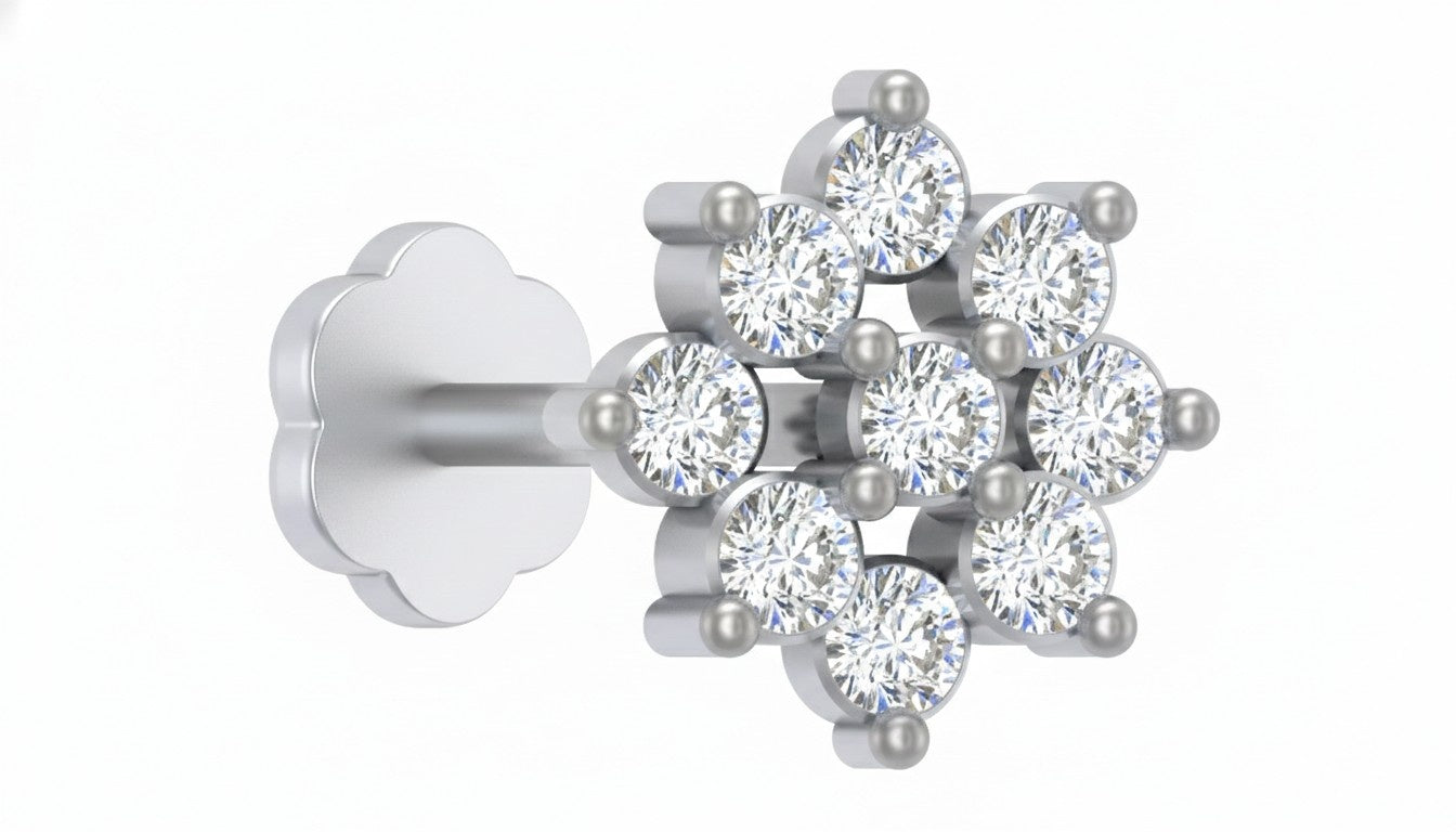 White gold and diamond stud nose pin with clear gemstones on a white background