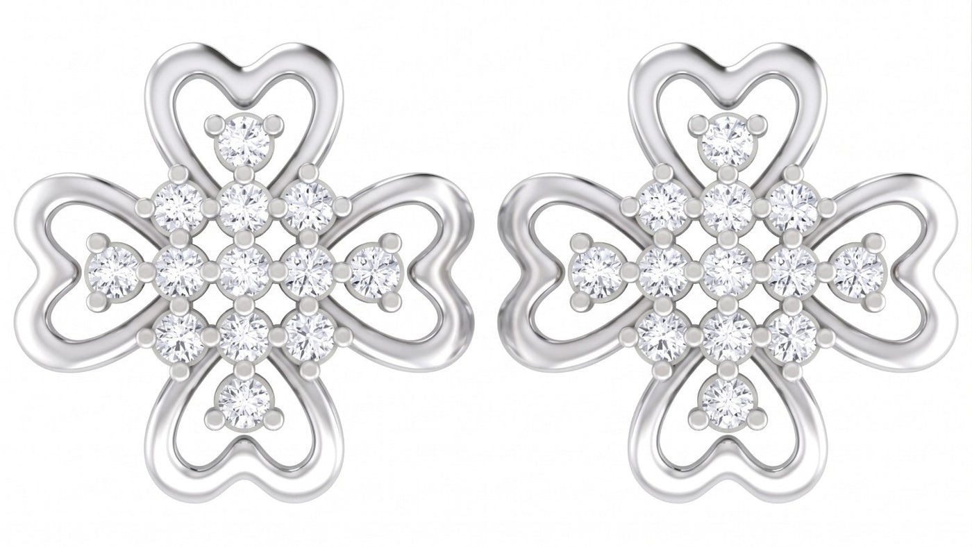 White gold and diamond stud earrings with floral-design on a white background
