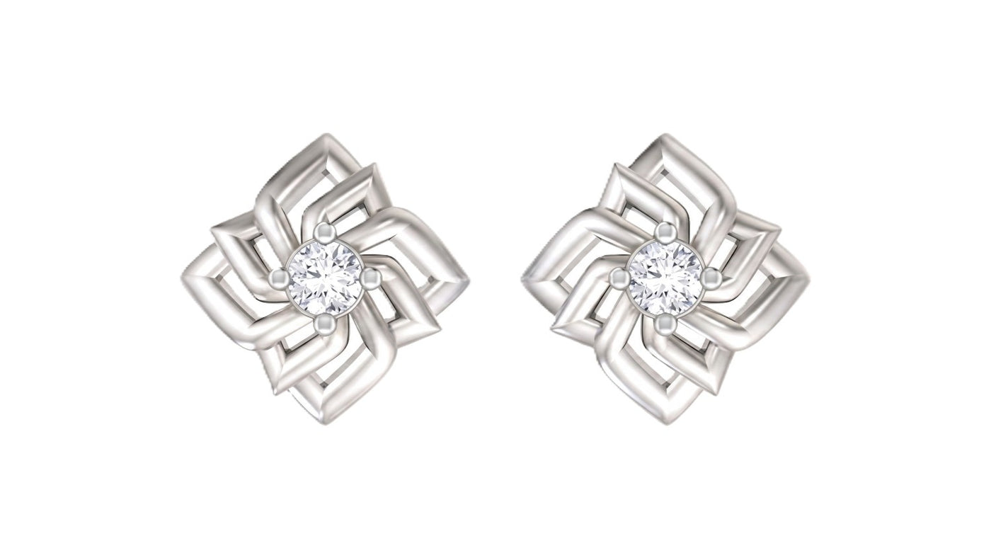 White gold and diamond swirl stud earrings on a white background