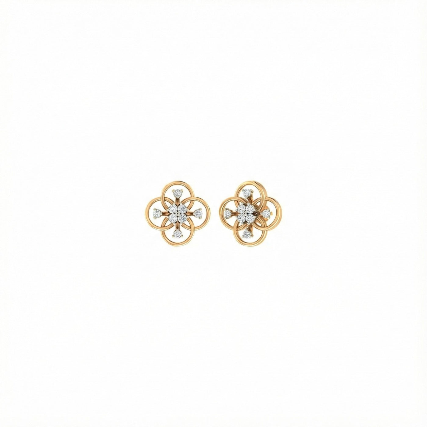 Pair of yellow gold flower-shaped earrings with diamond-like stones on a white background