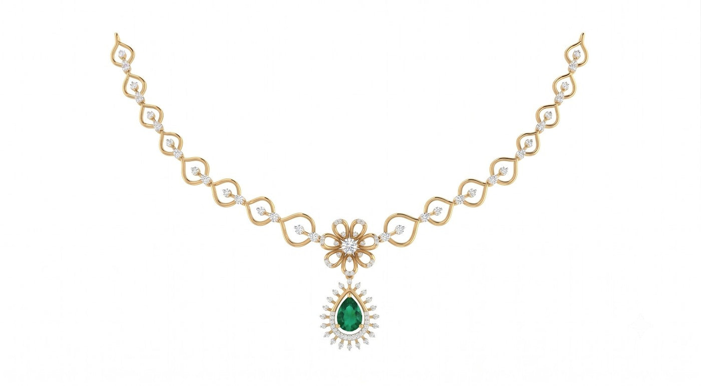 Yellow gold necklace with a green gemstone on a white background.