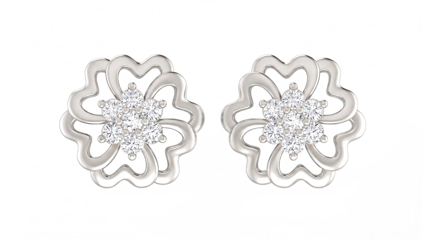 White gold and diamond stud earrings with floral design on a white background