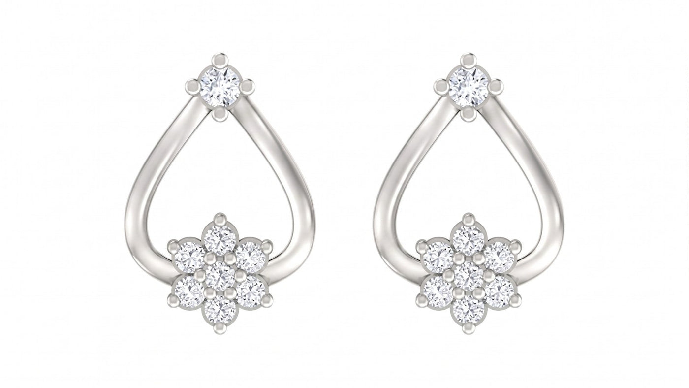 White gold and diamond floral stud earrings on a white background.