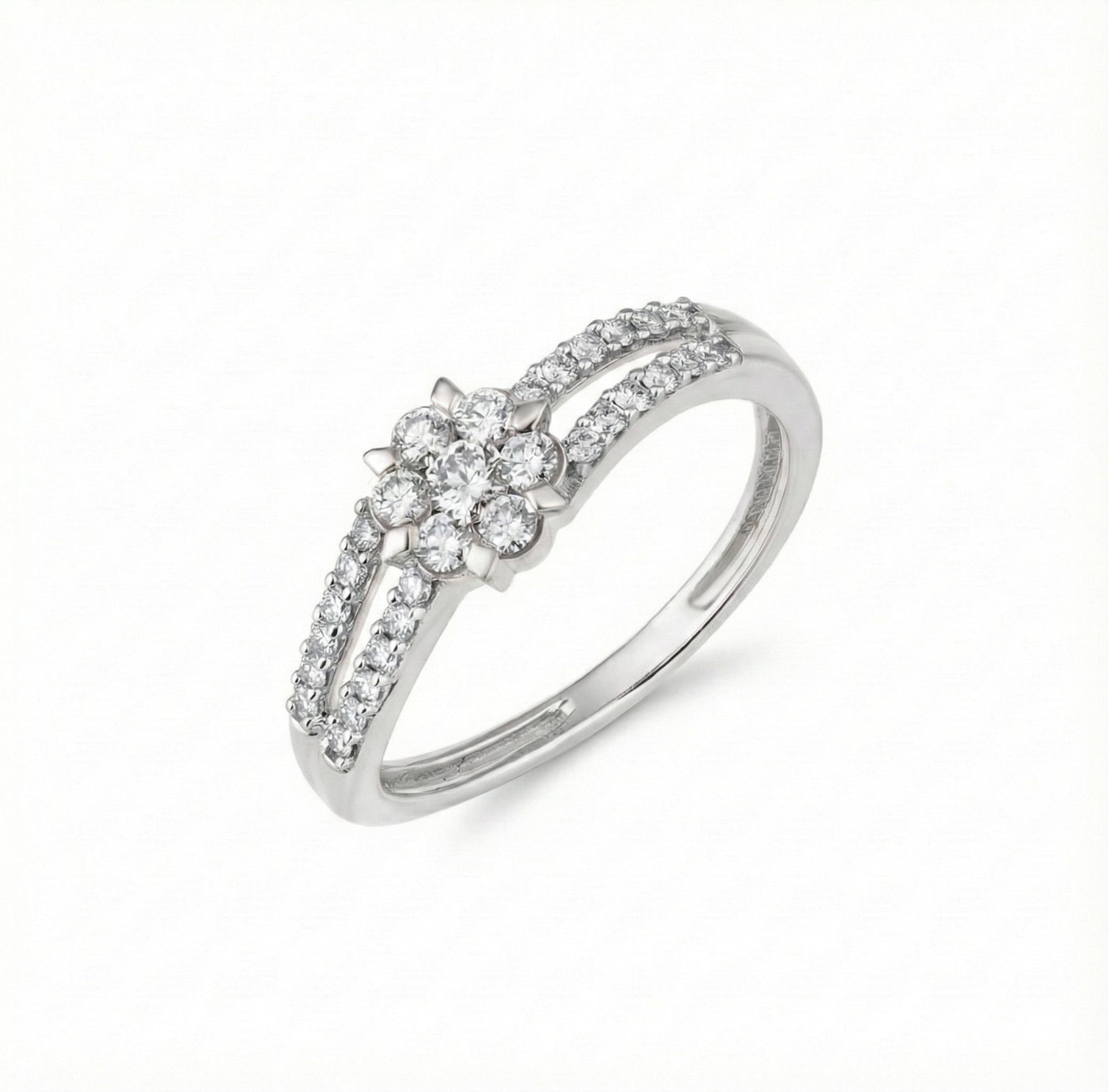 White gold ring with small diamonds on a white background