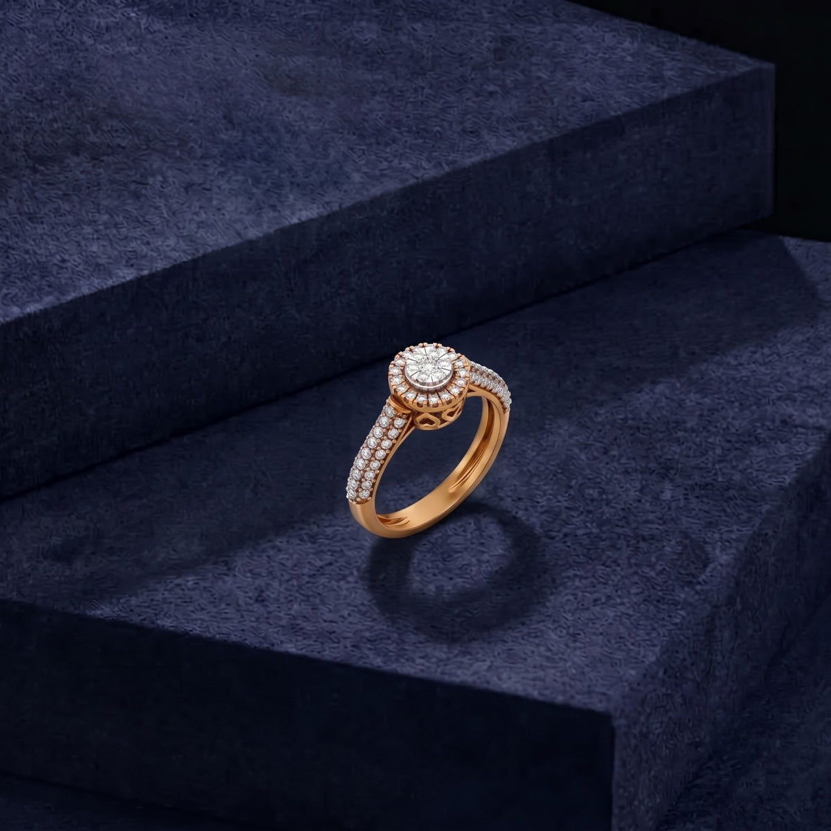 Gold ring with diamonds on a dark blue textured surface.