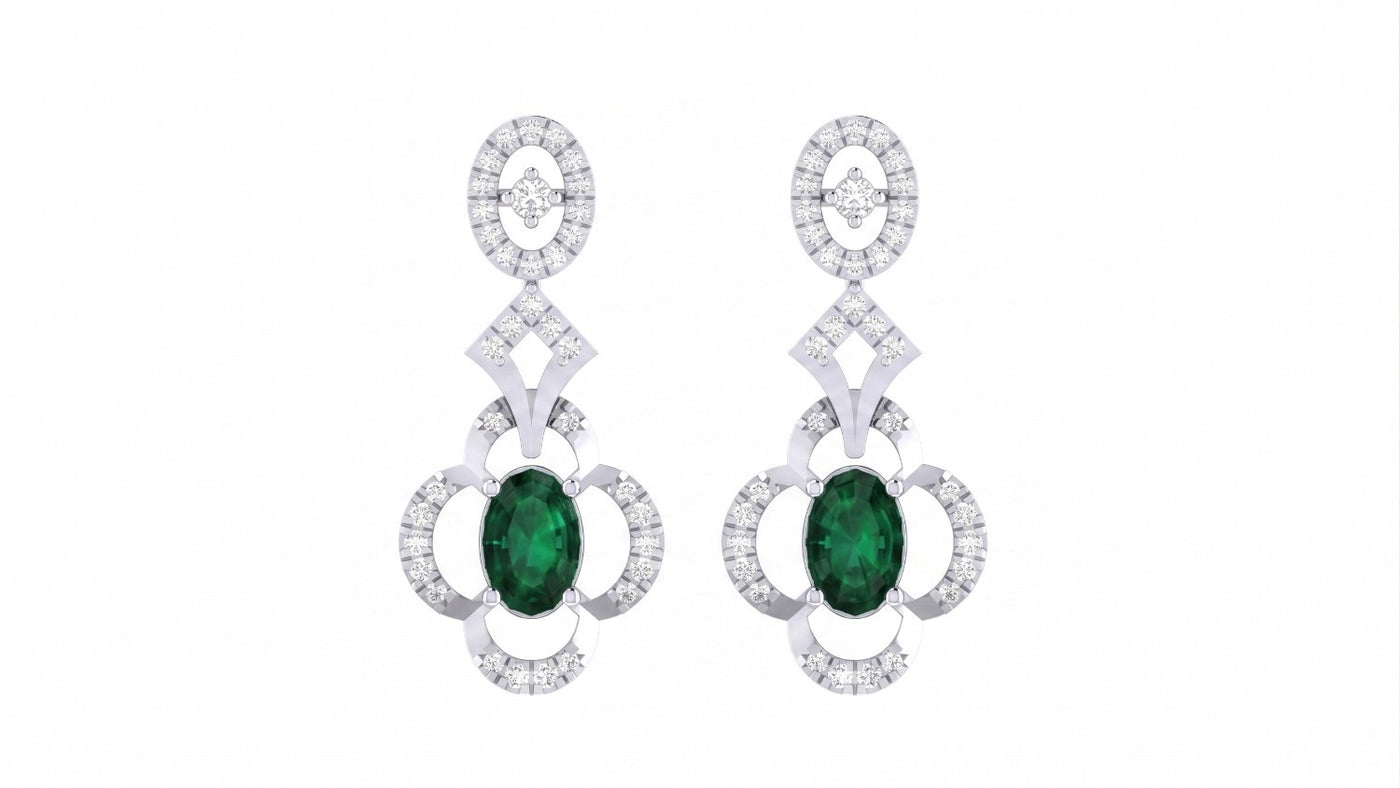 Pair of white gold earrings with green gemstones and rose gold and silver accents on a white background