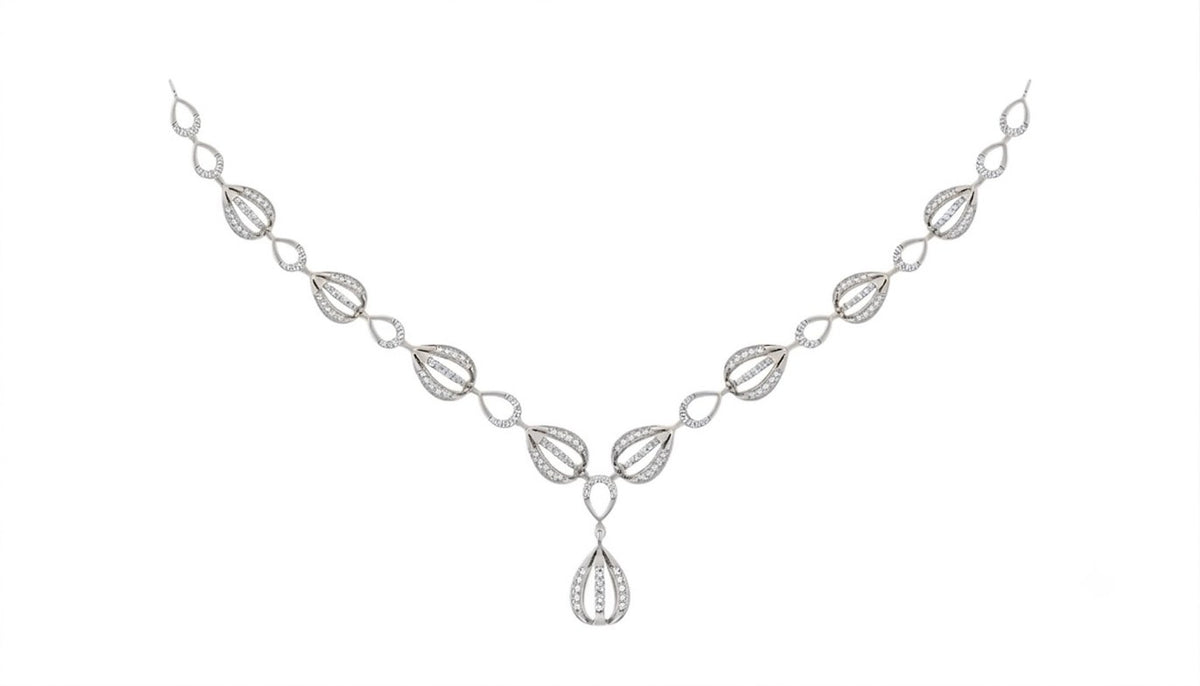 White gold and diamond necklace with a teardrop shaped, on a plain white background.