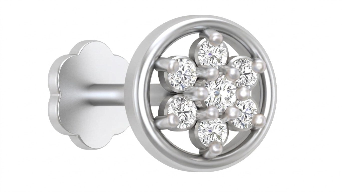 White gold and diamond stud nose pin on a brown fabric background