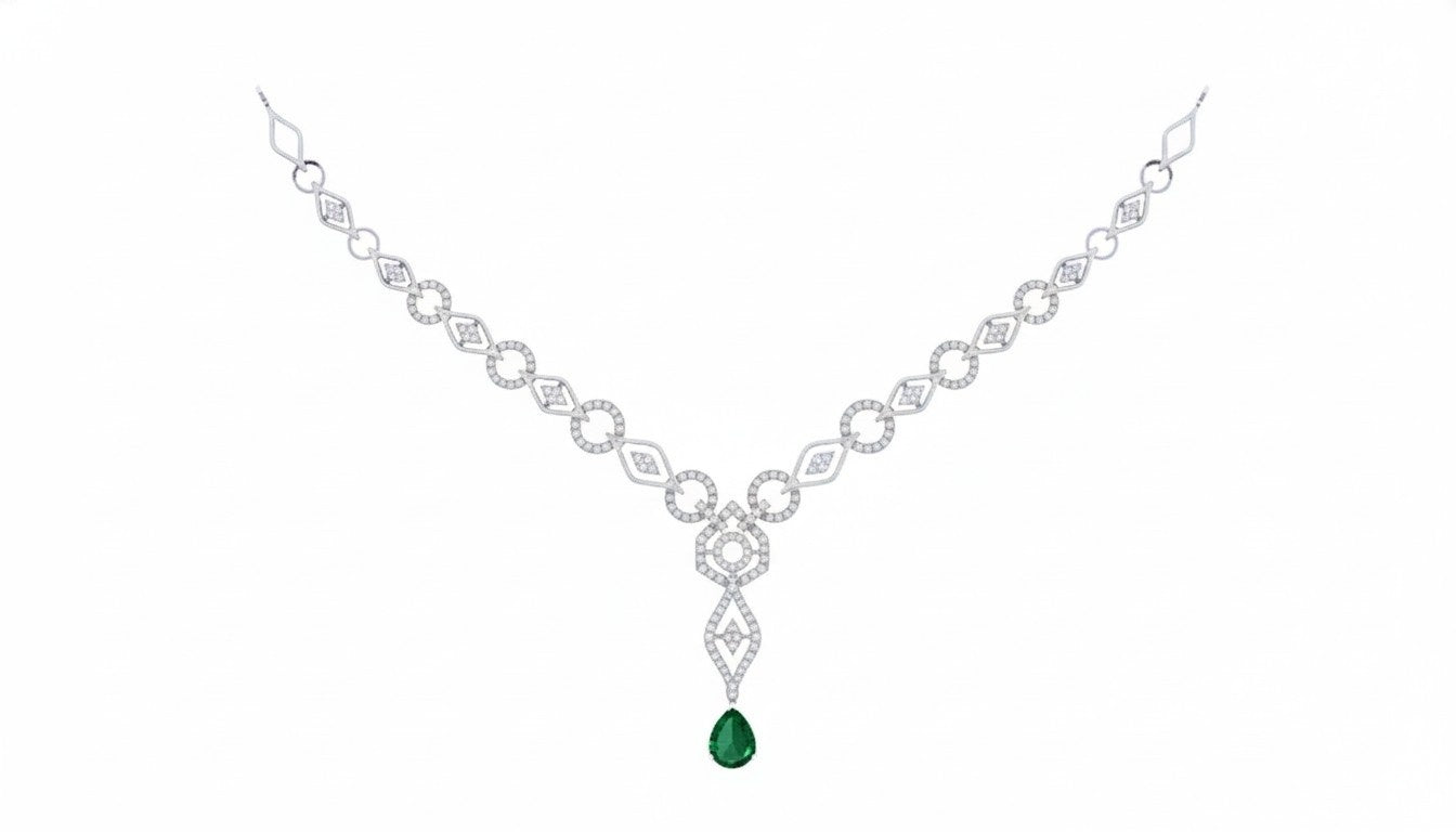 White gold and diamond necklace with a green gemstone on a white background