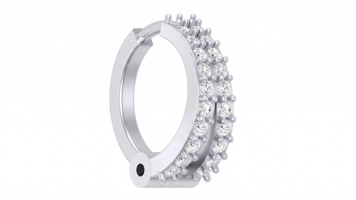 A white gold and diamond nose pin with a pavé setting of clear round gemstones, shown on a plain white background.