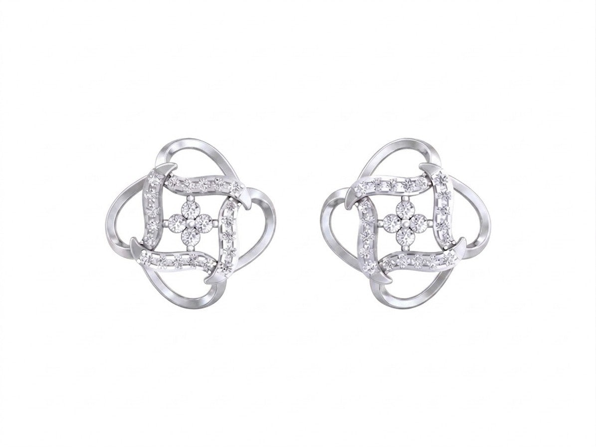 Pair of white gold and diamond floral-design stud earrings on a white background.