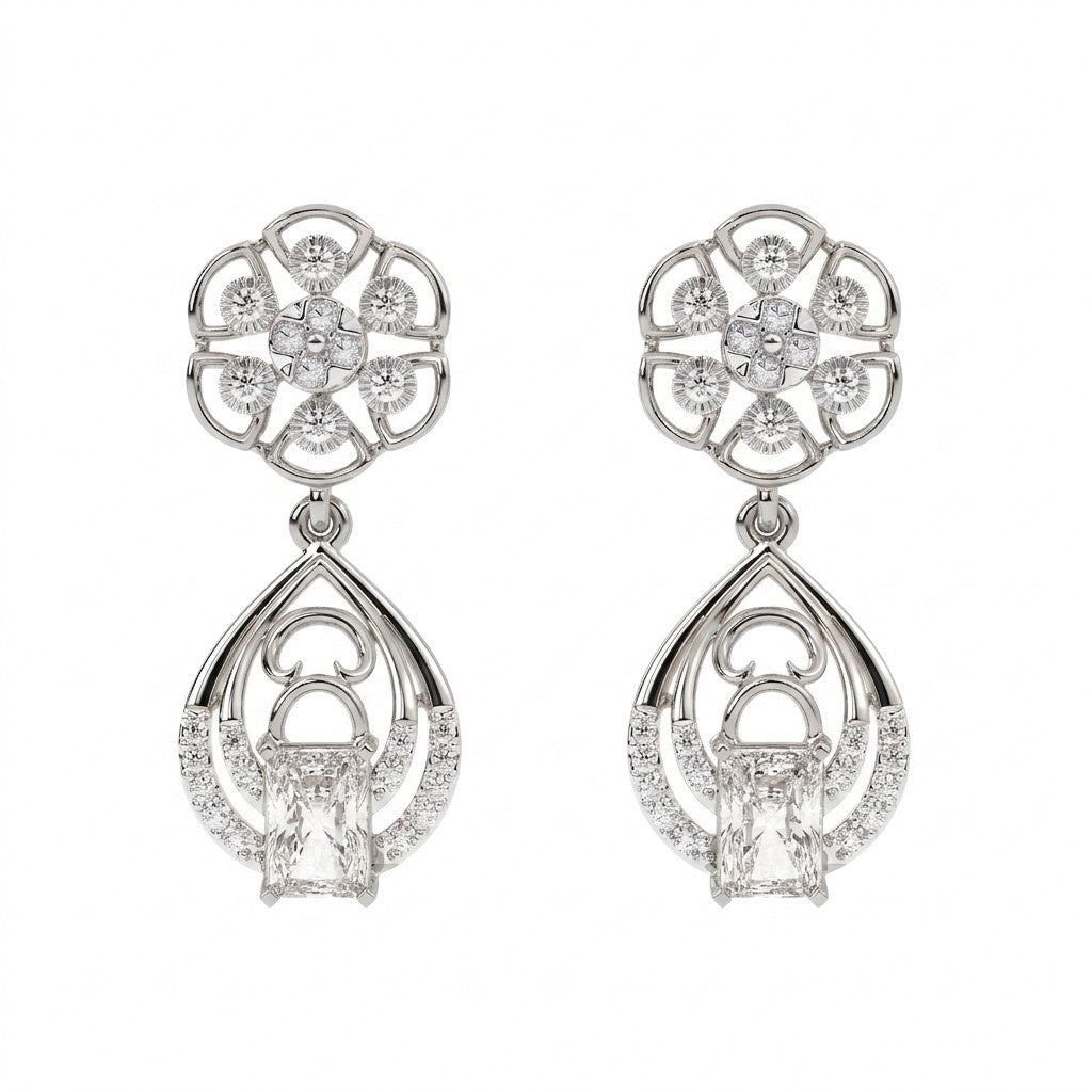 White gold and diamond dangler earring with floral-shaped on a white background.