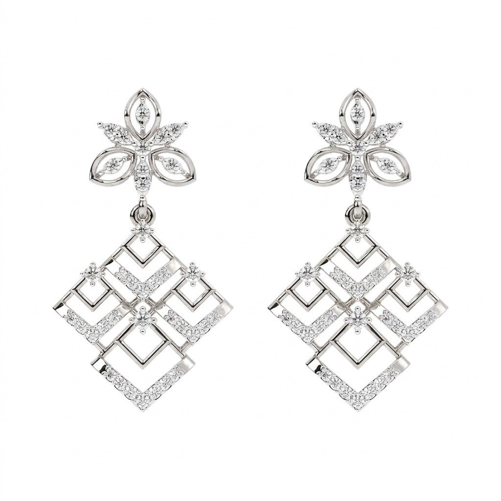 Pair of white gold and diamond earrings on a white background

