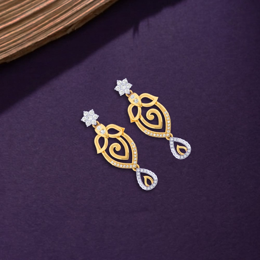 Gold and diamond earrings with intricate designs on a purple background.