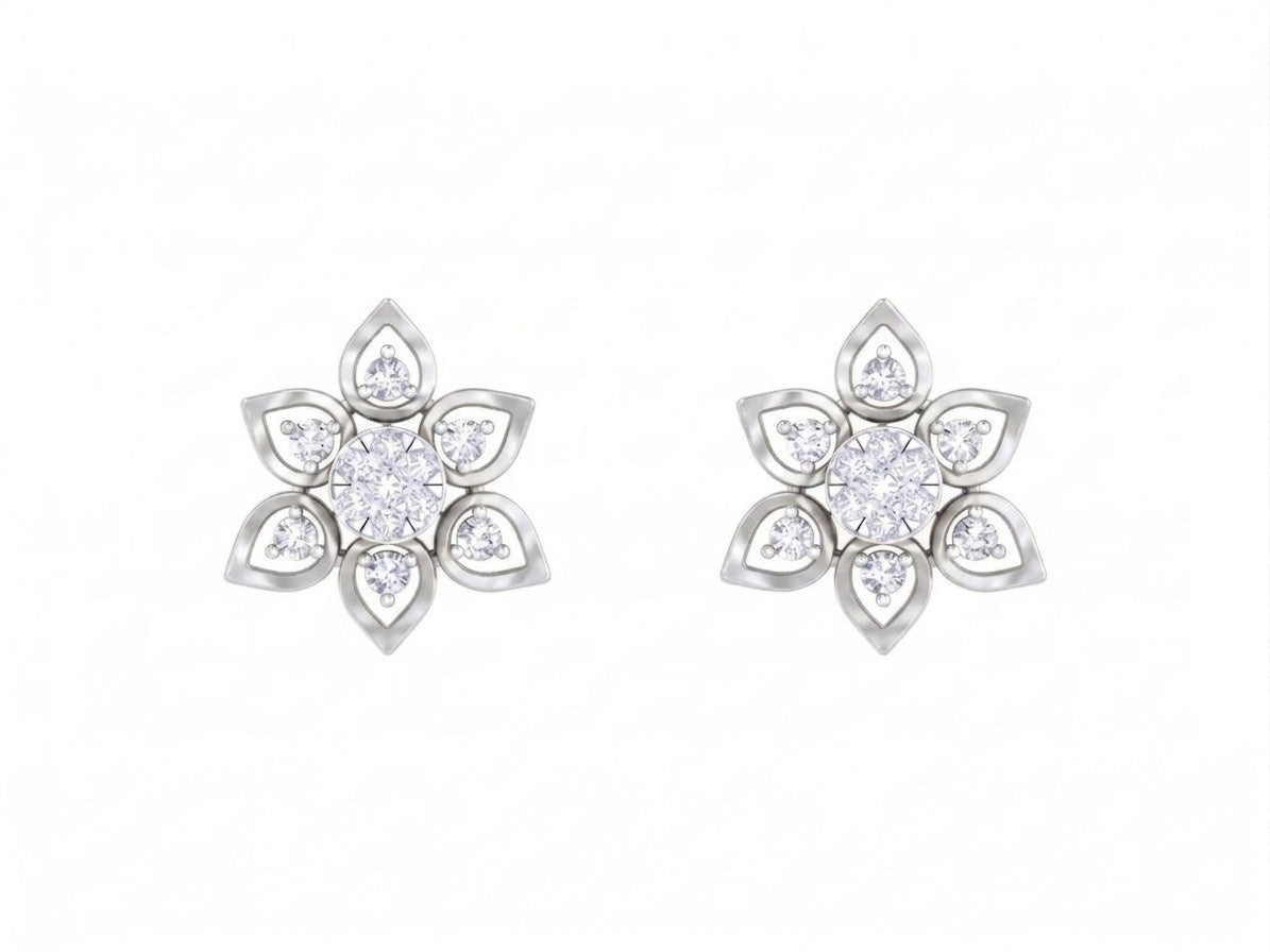 White gold and diamond floral stud earrings on a white background