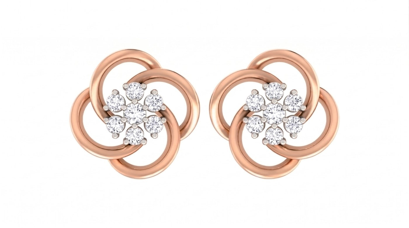 Rose gold and diamond floral stud  earrings on a white background