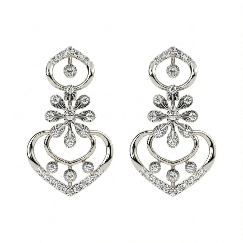 Pair of white gold and diamond earrings on a white background
