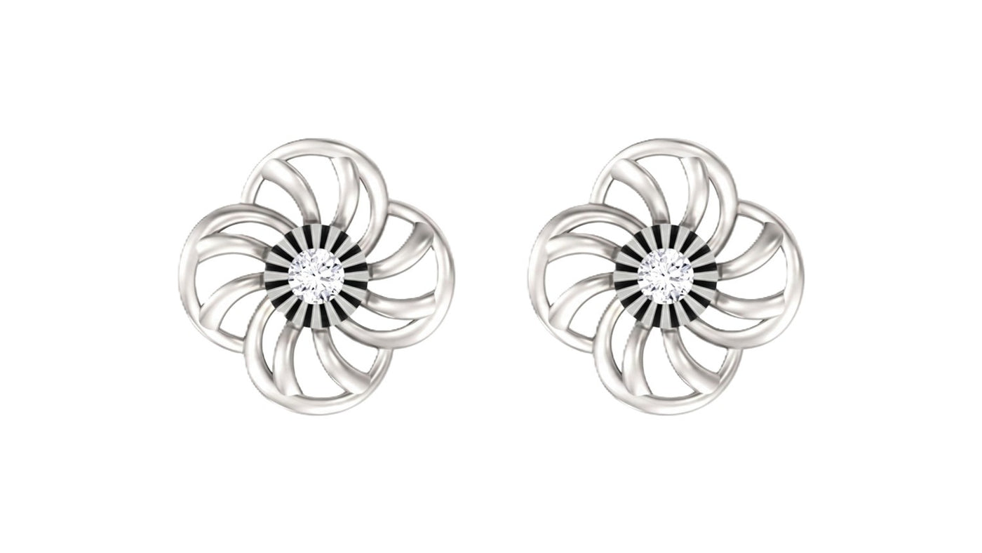 White gold and diamond floral stud earrings on a white background