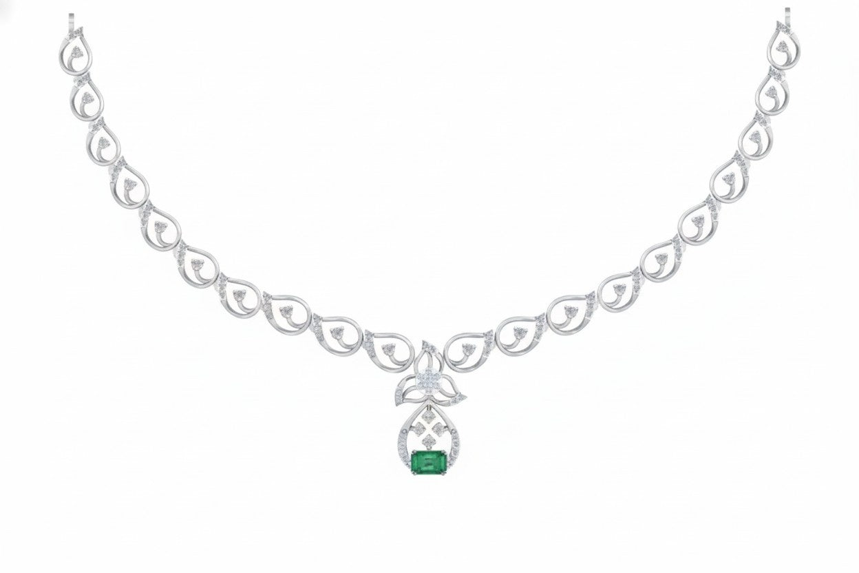 White gold and diamond necklace with a green gemstone on a white background
