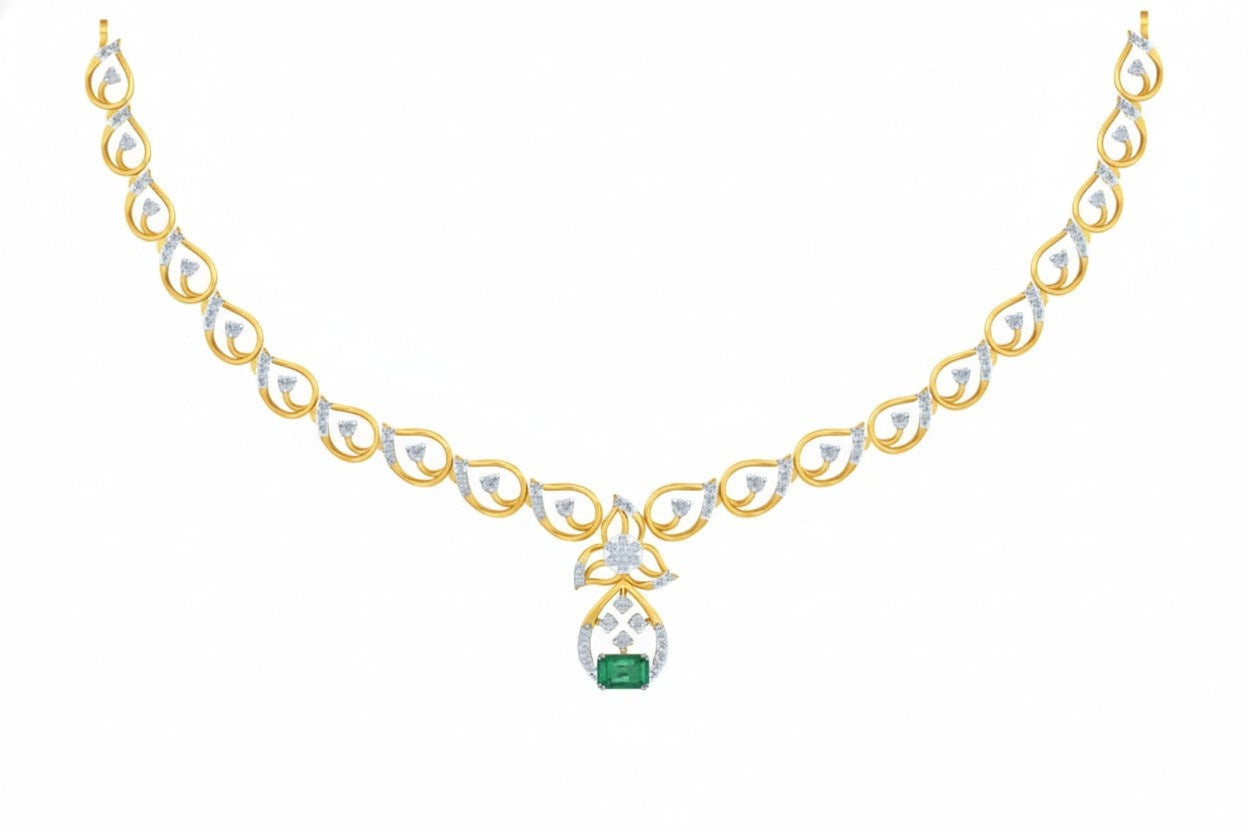 Yellow gold necklace with a green gemstone on a white background