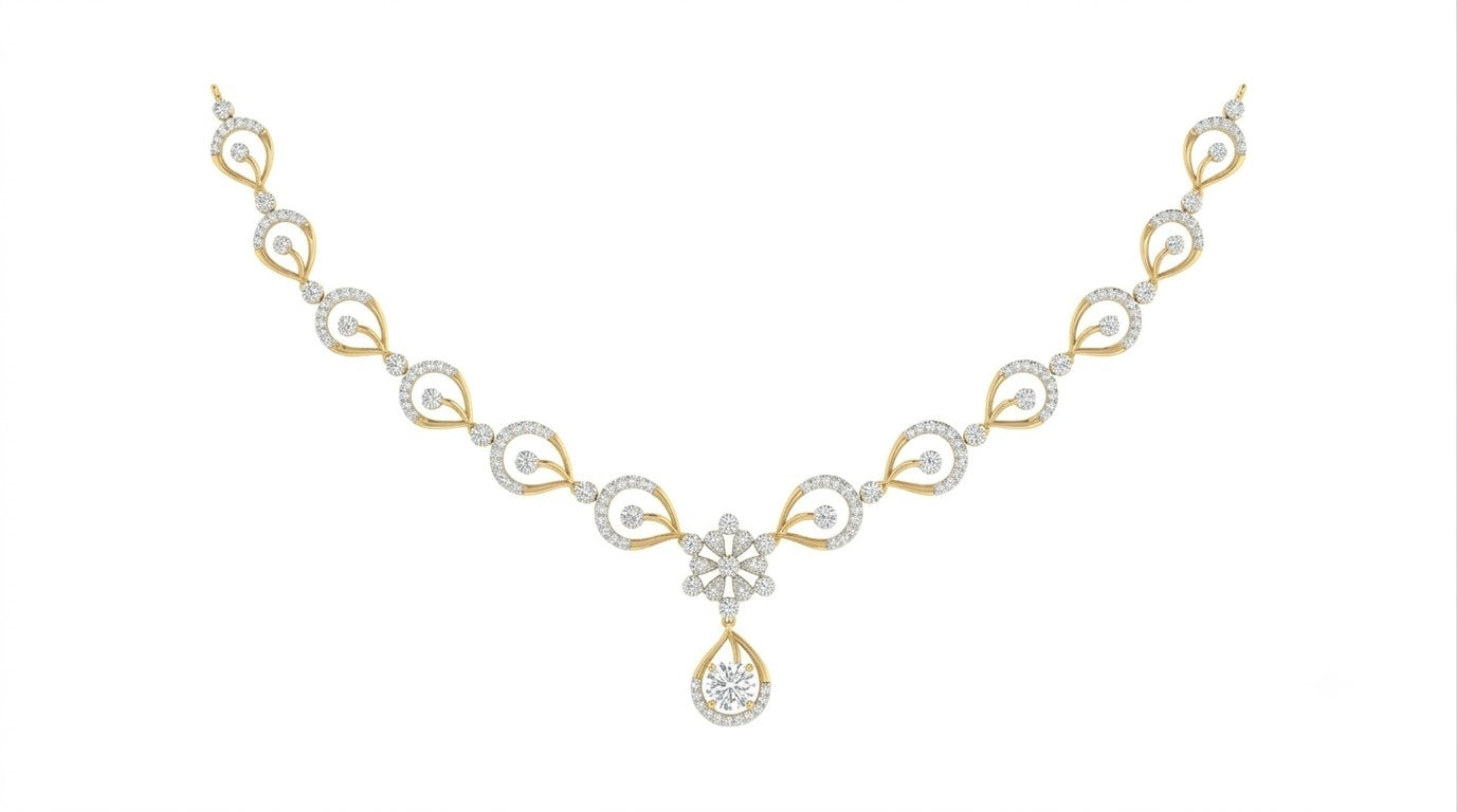 A yellow gold and diamond necklace with a teardrop pendant, displayed on a solid white background.