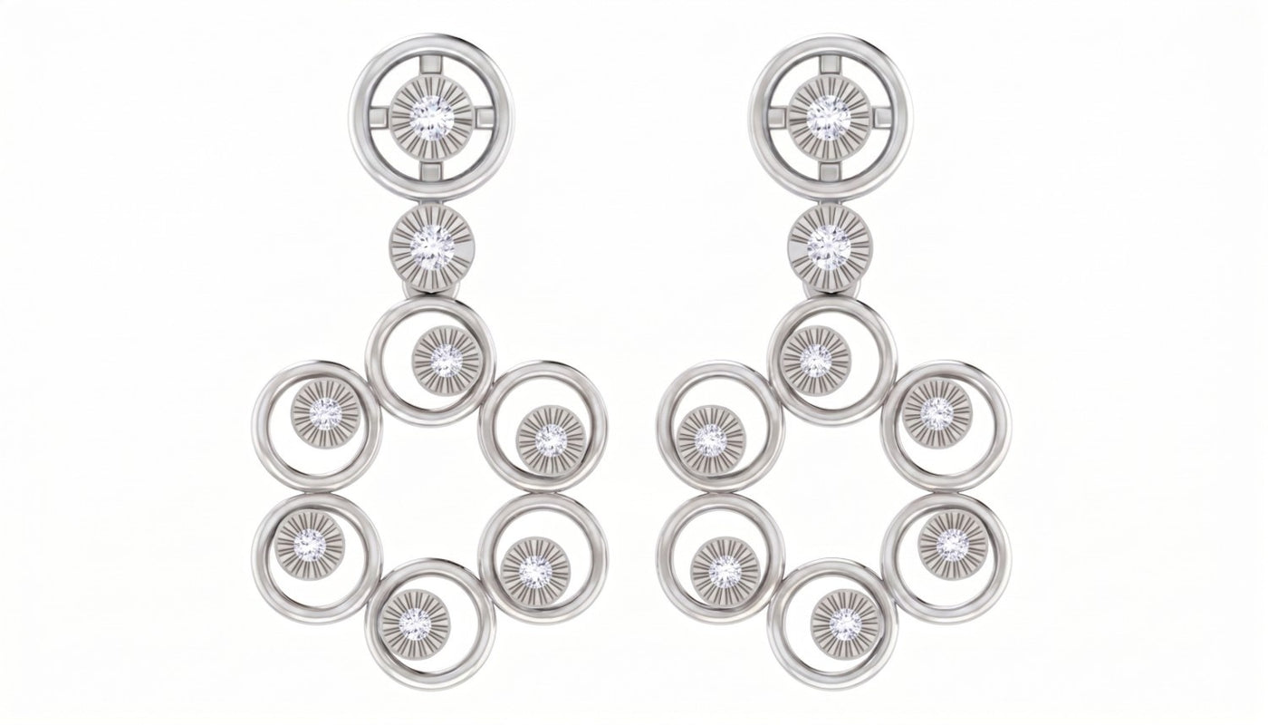 White gold and diamond drop earrings on a white background.