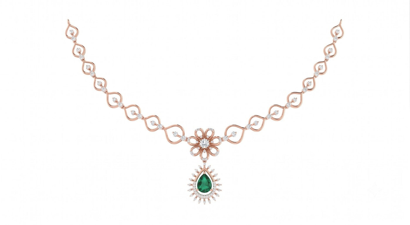 Rose gold necklace with a green gemstone on a white background.