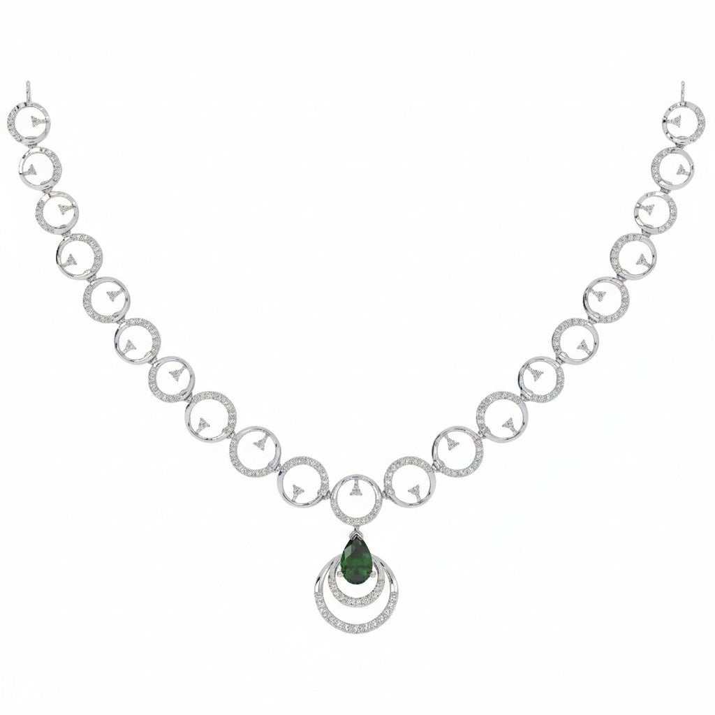 A white gold and diamond necklace featuring repeating interlocking circular links, a teardrop-shaped green gemstone pendant, shown on a plain white background.