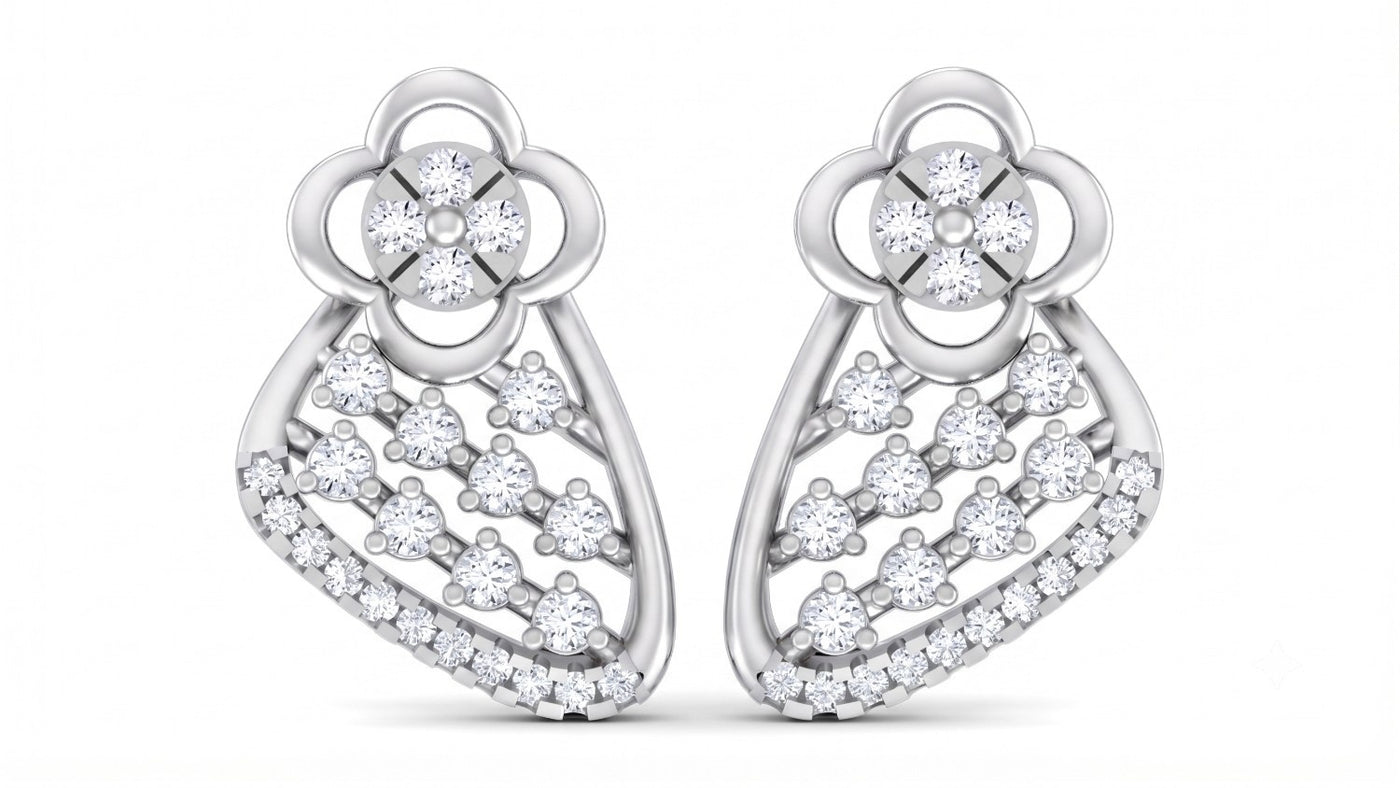 A pair of ornate, white gold earrings featuring intricate floral-inspired designs at the top and delicate, sweeping curves.