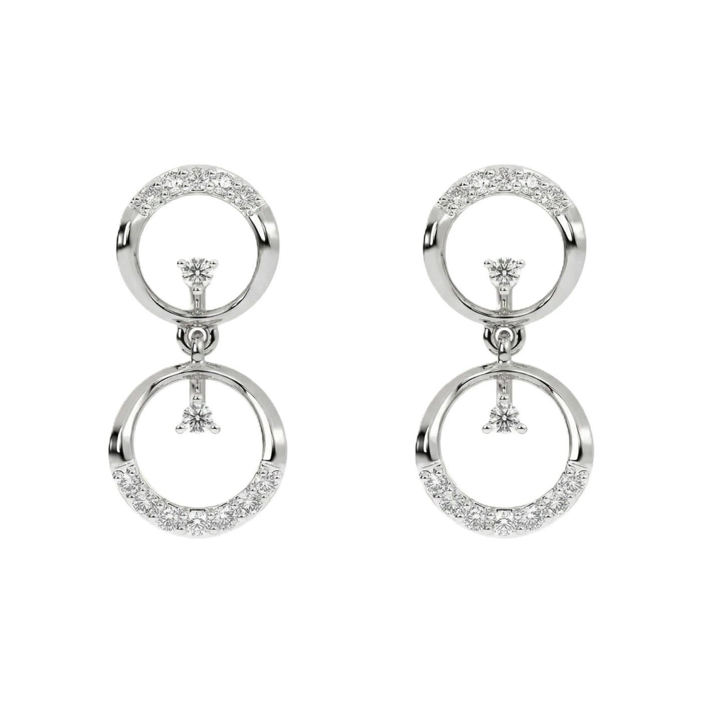 White gold and diamond earrings with circular designs on a white background