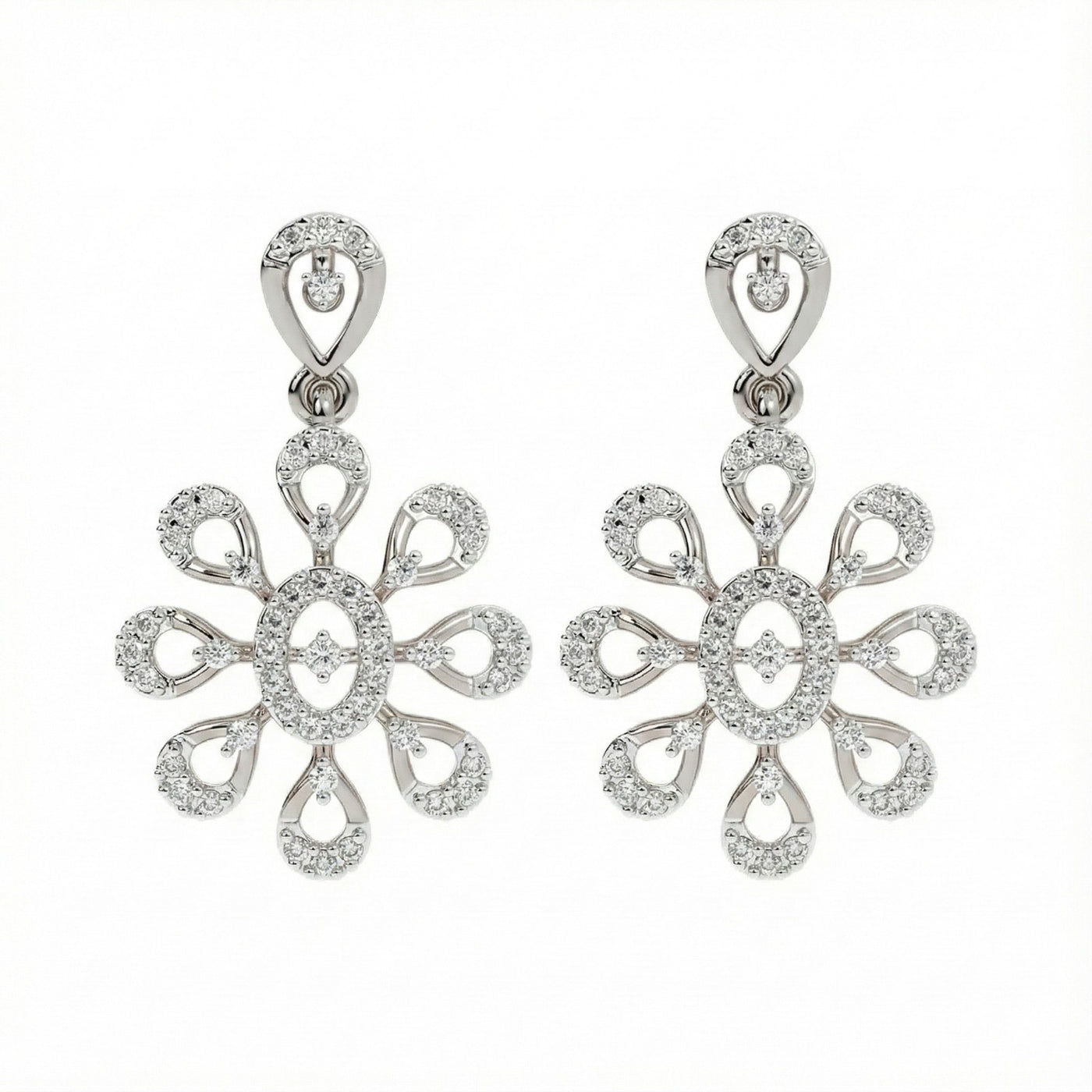 A pair of white gold earrings with intricate diamond settings, featuring a floral design.