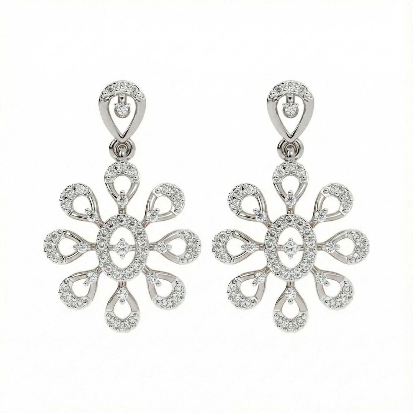 A pair of white gold earrings with intricate diamond settings, featuring a floral design.