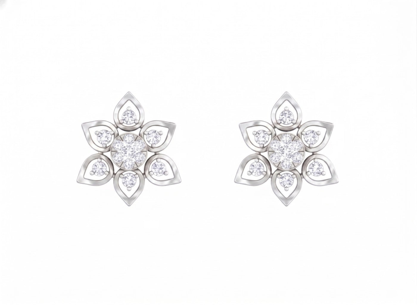 White gold and diamond floral stud earrings on a white background