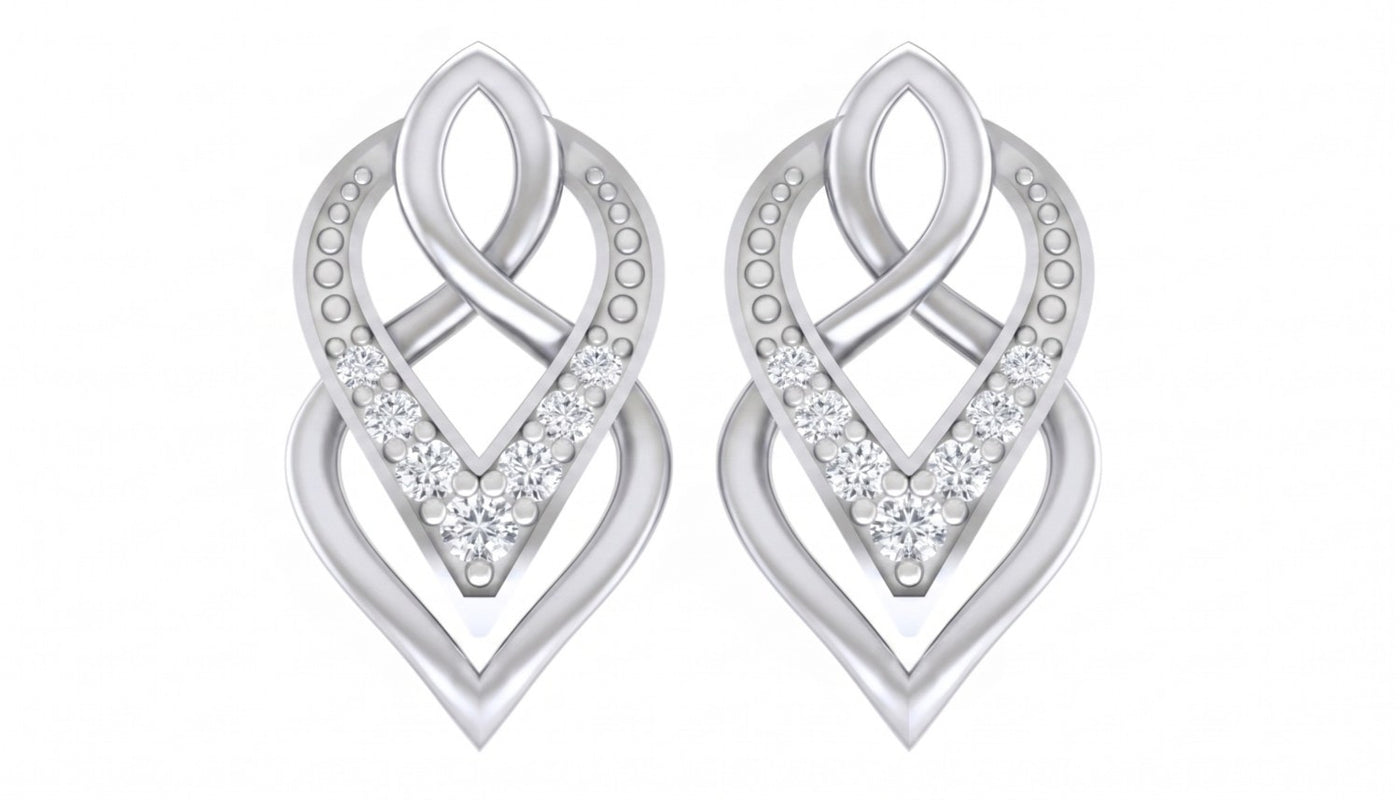 White gold and diamond earrings on a white background