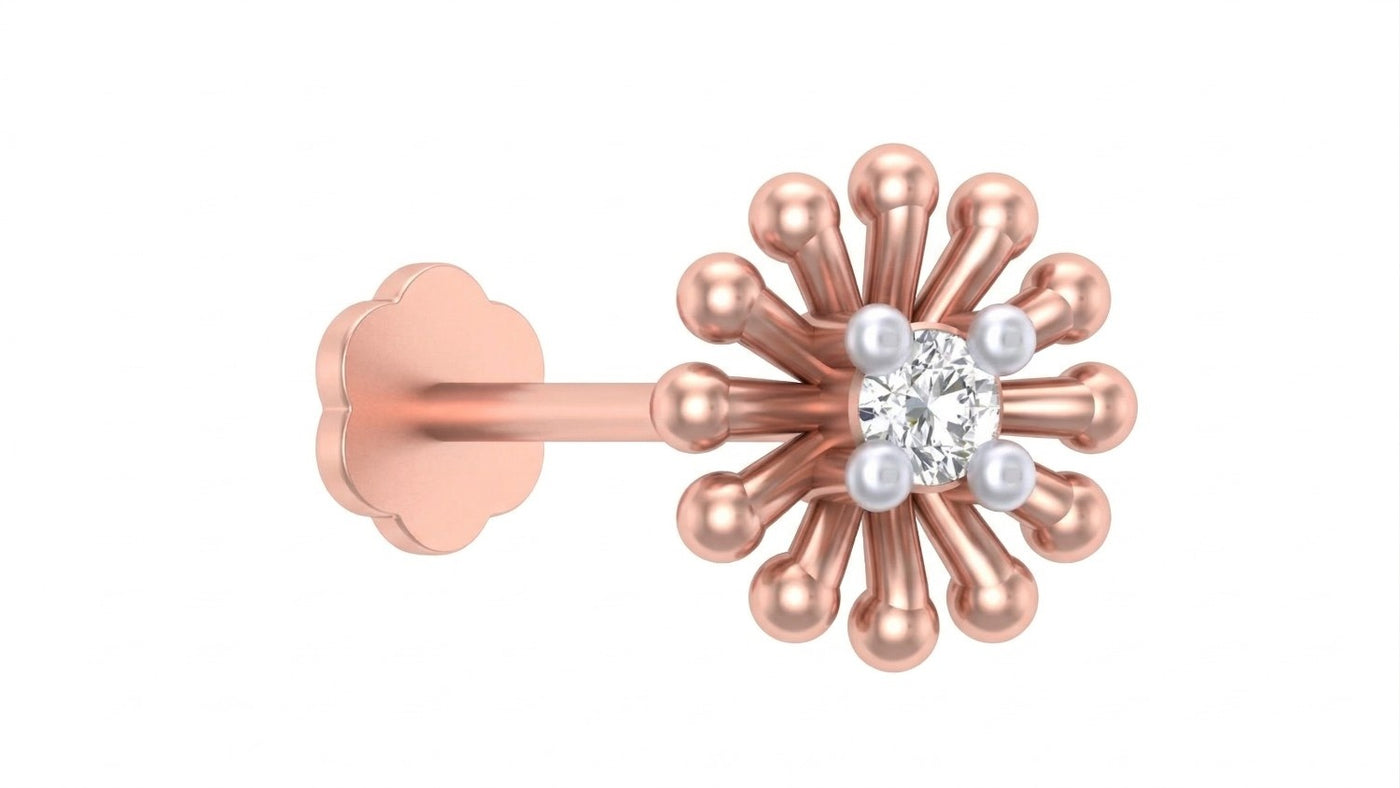 Rose gold and diamond stud nose pin with a central diamond and smaller pearls on a white background