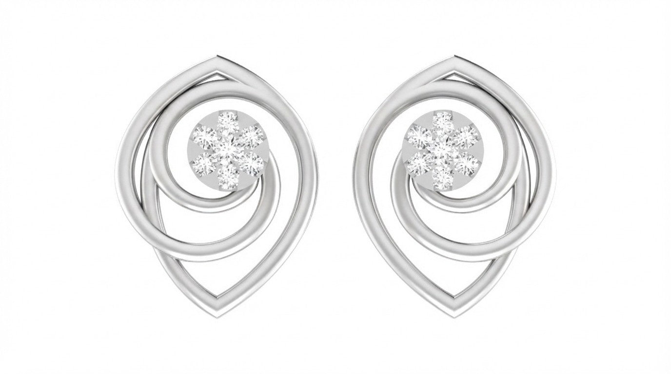 White gold and diamond earrings with circular designs on a white background.