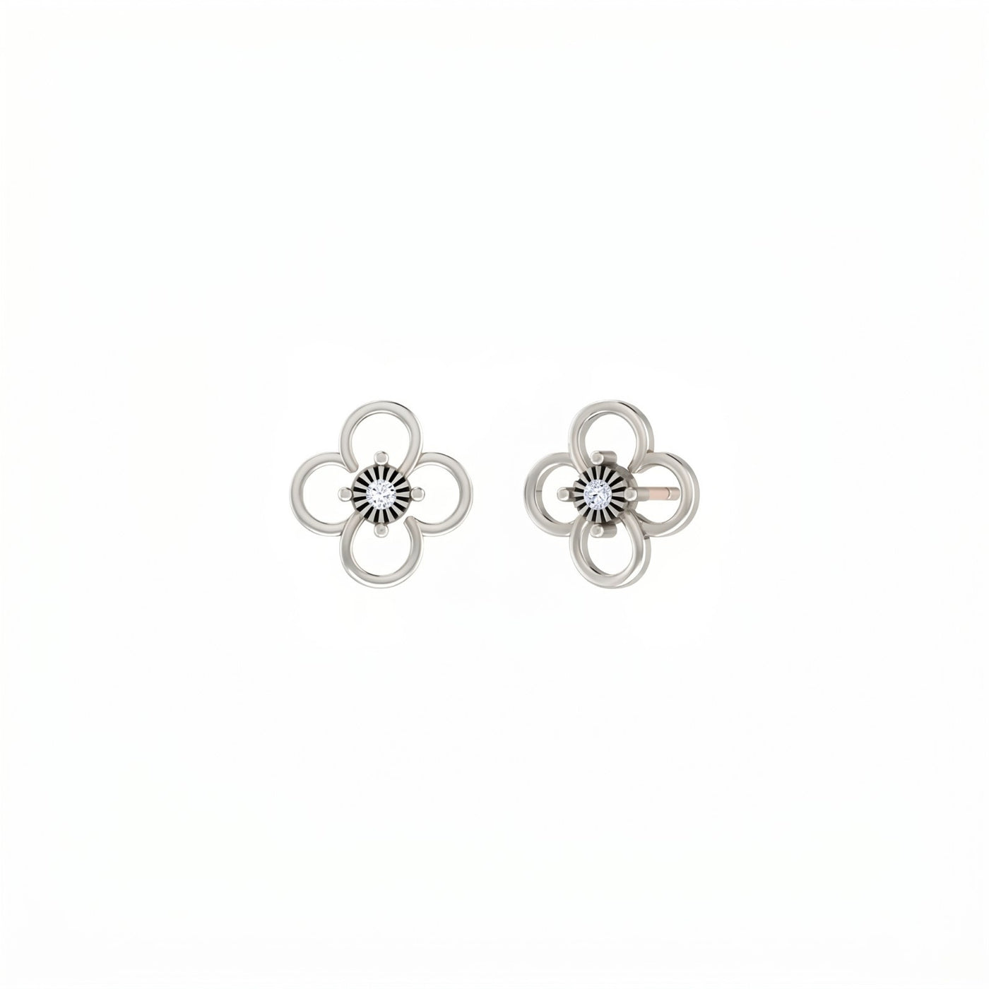 White gold and diamond floral earrings on a white background.