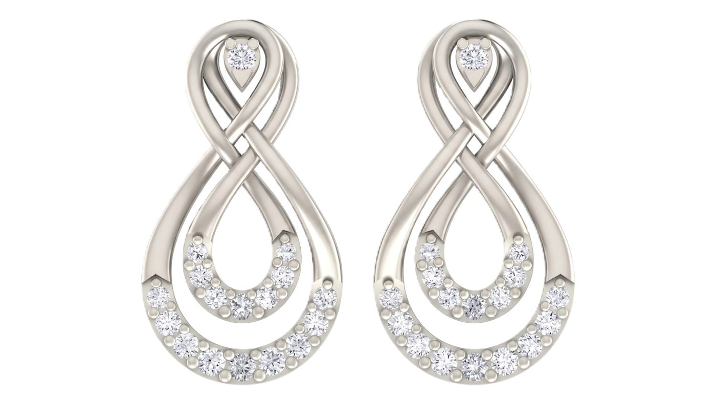 White gold and diamond stud earrings on a white background