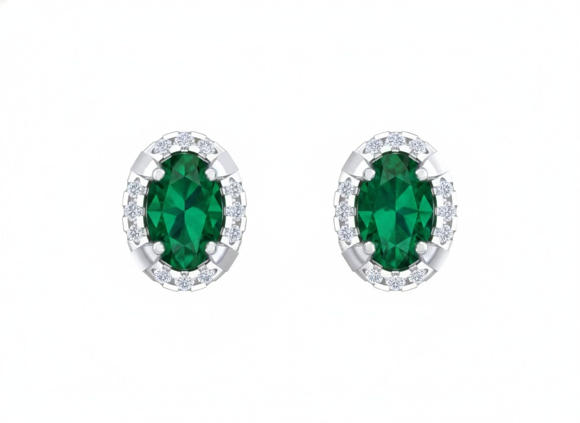White gold and diamond stud  earrings with emerald gemstones on a white background