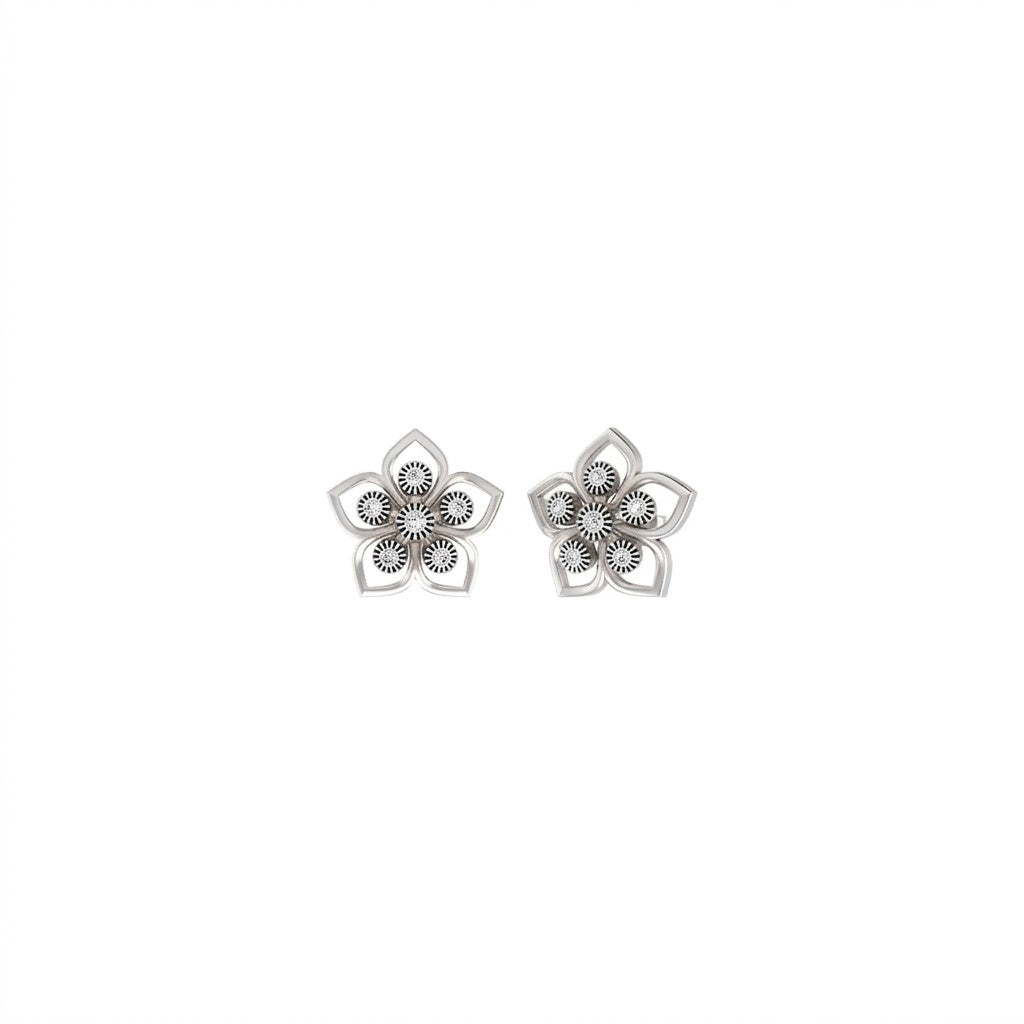Pair of white gold and diamond floral-design stud earrings on a white background.
