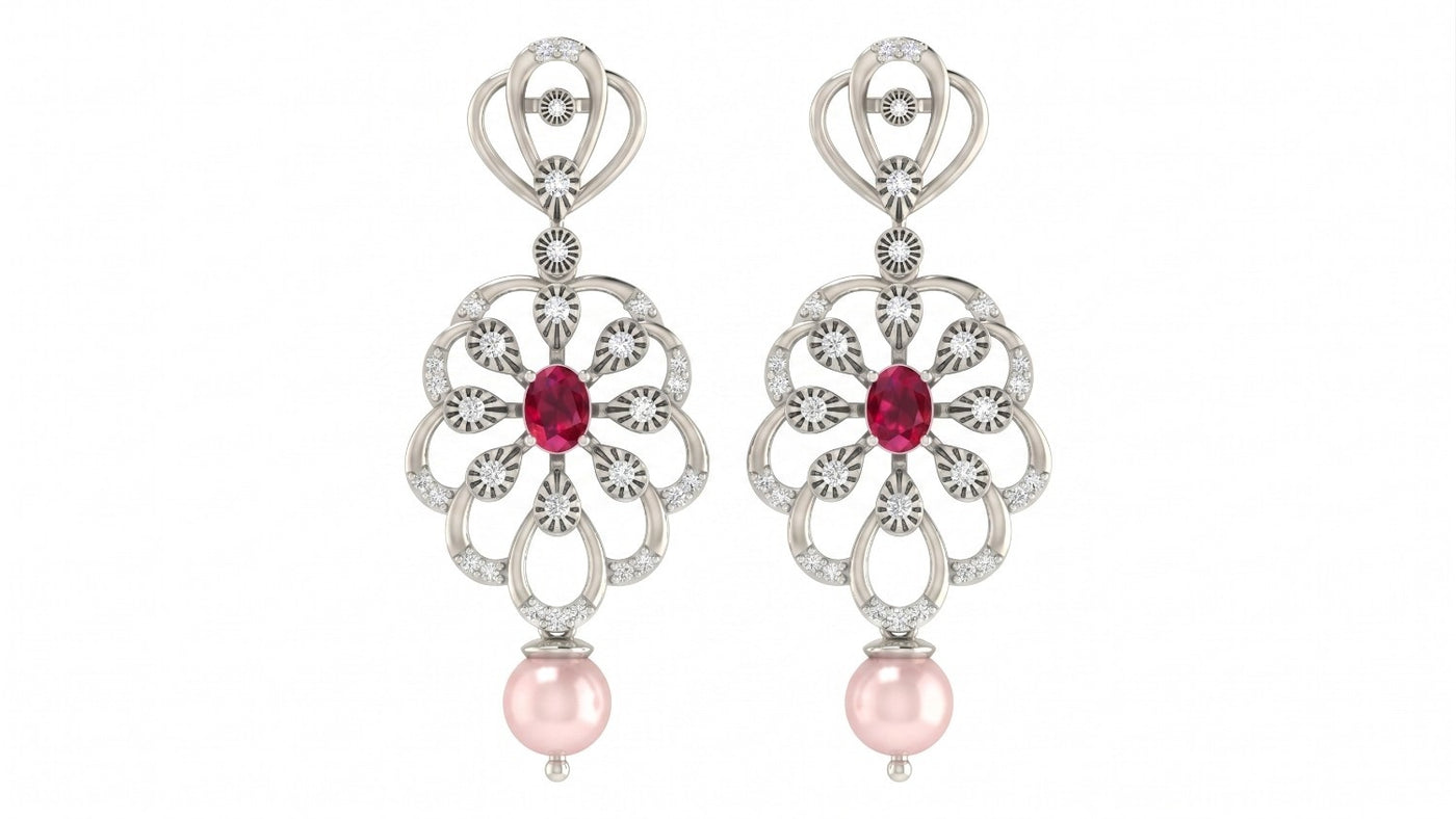 A pair of white gold dangle earrings featuring a central red gemstone surrounded by diamond