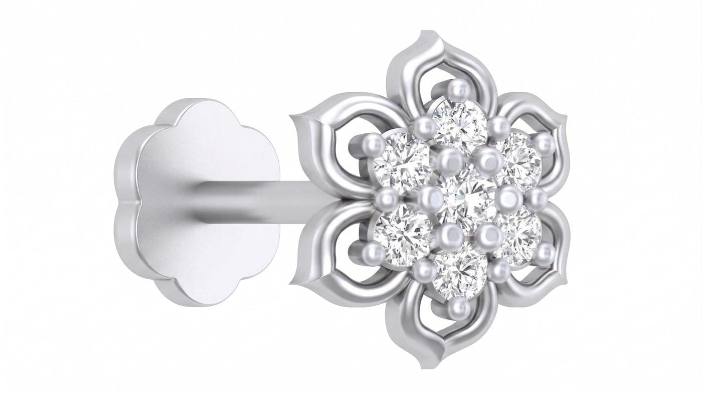 A single floral stud in white gold and diamond stud nose pin featuring a cluster of clear round-cut stones and small white pearls at the center, with a matching gold flower-shaped backing on a plain white background.