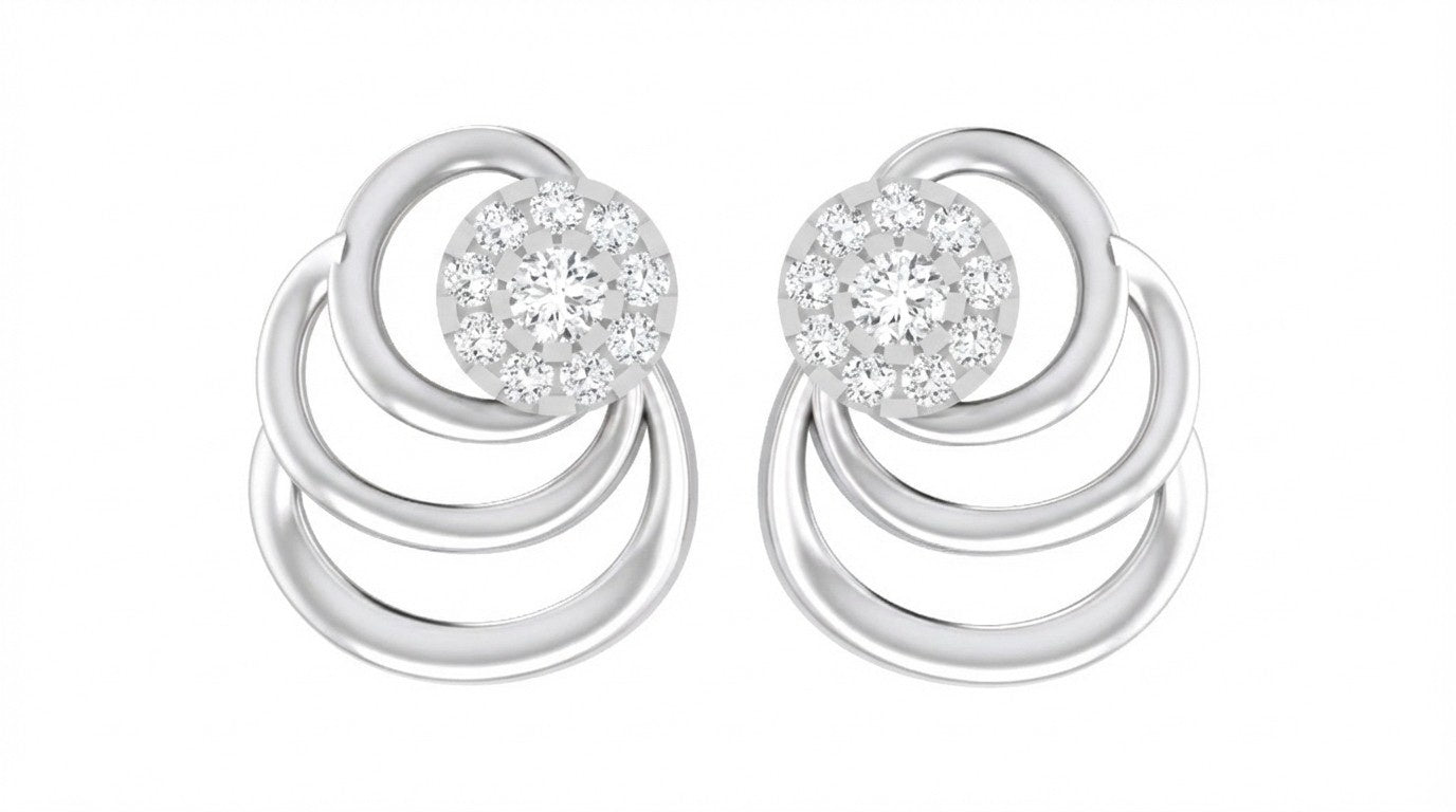 White gold and diamond stud earrings with circular designs on a white background.