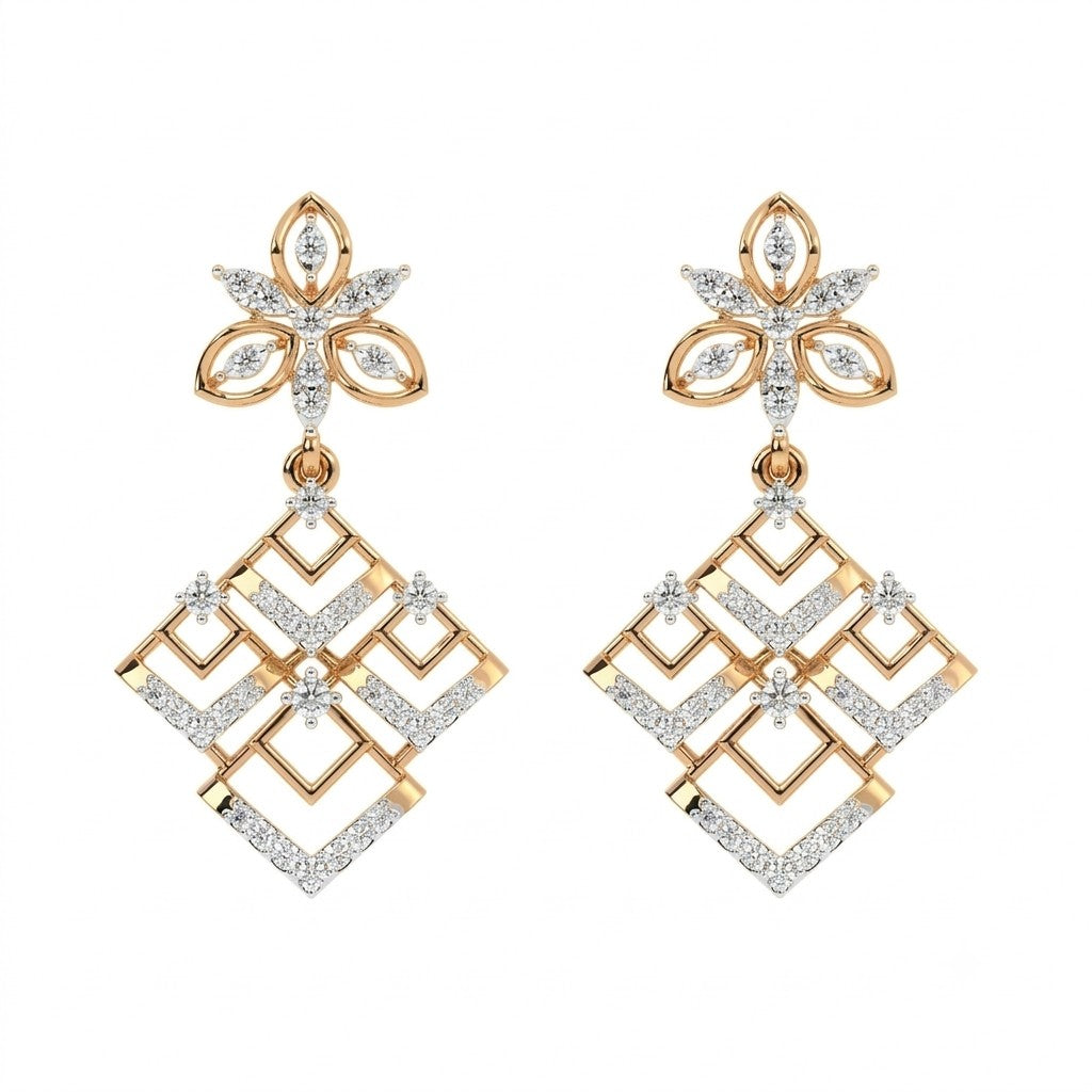A pair of yellow gold and diamond dangler earrings, featuring a floral stud top and a geometric diamond-shaped dangle.
