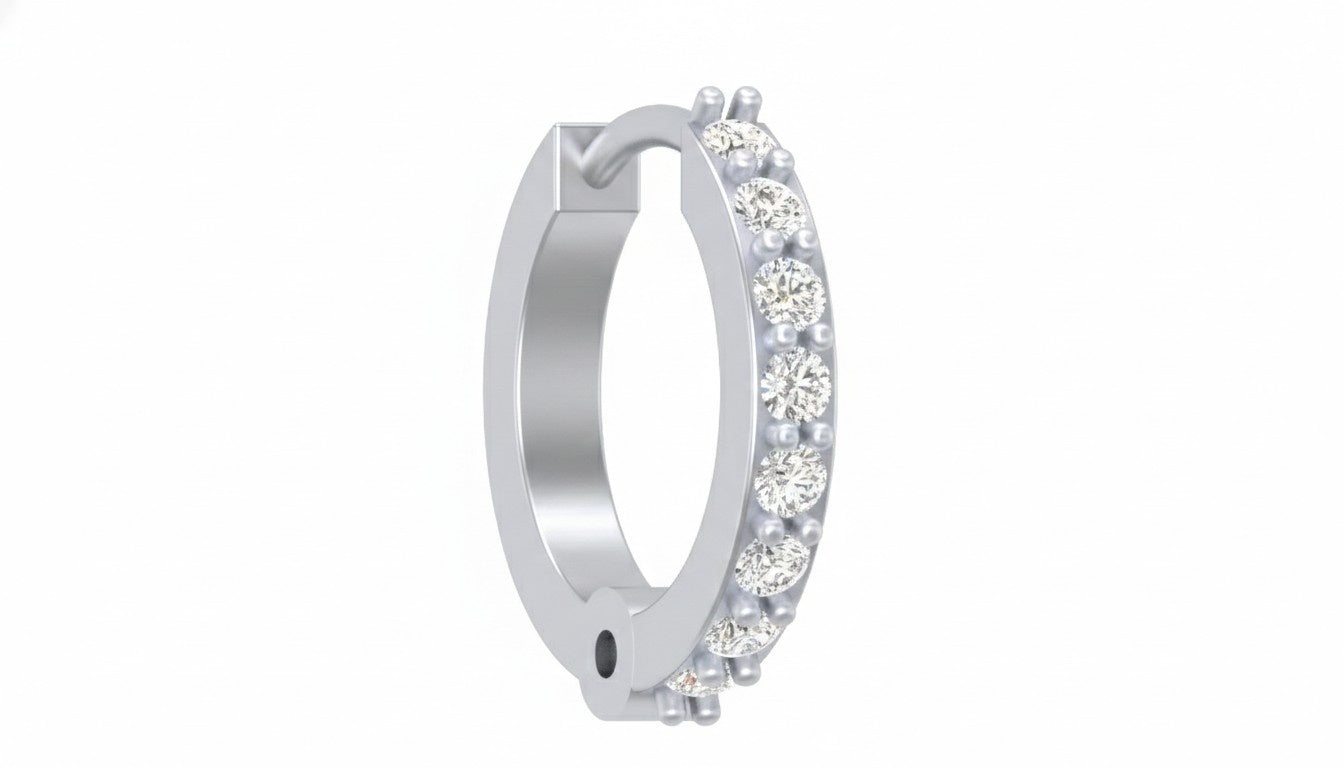 white gold and diamond nose ring with diamond accents on a white background