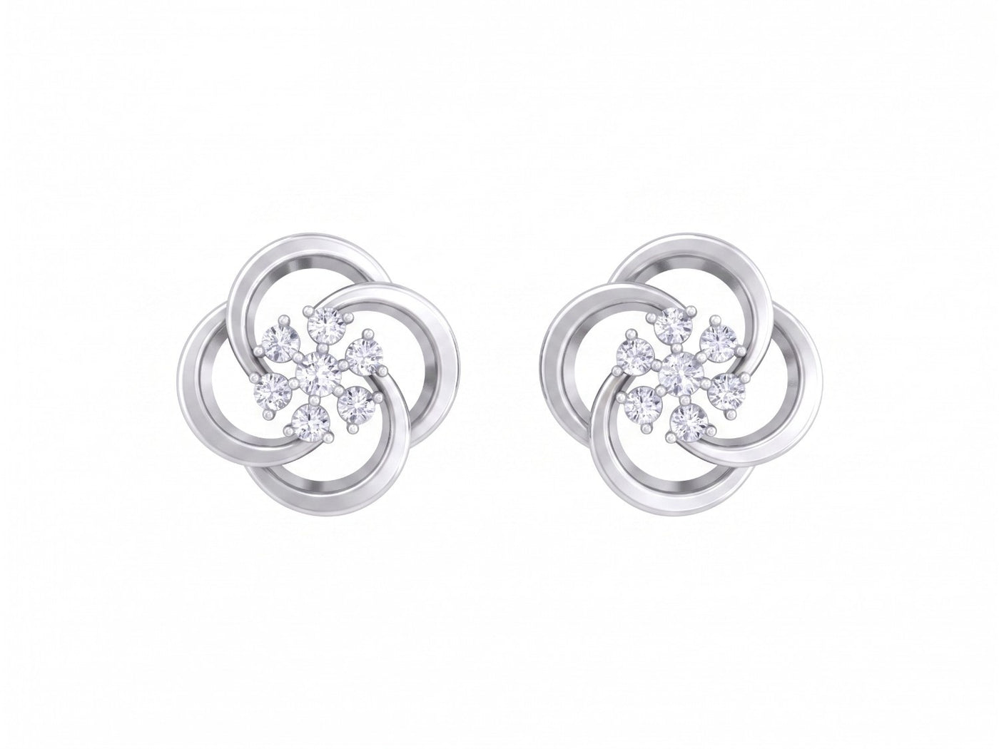 White gold and diamond stud earrings with floral-design on a white background.